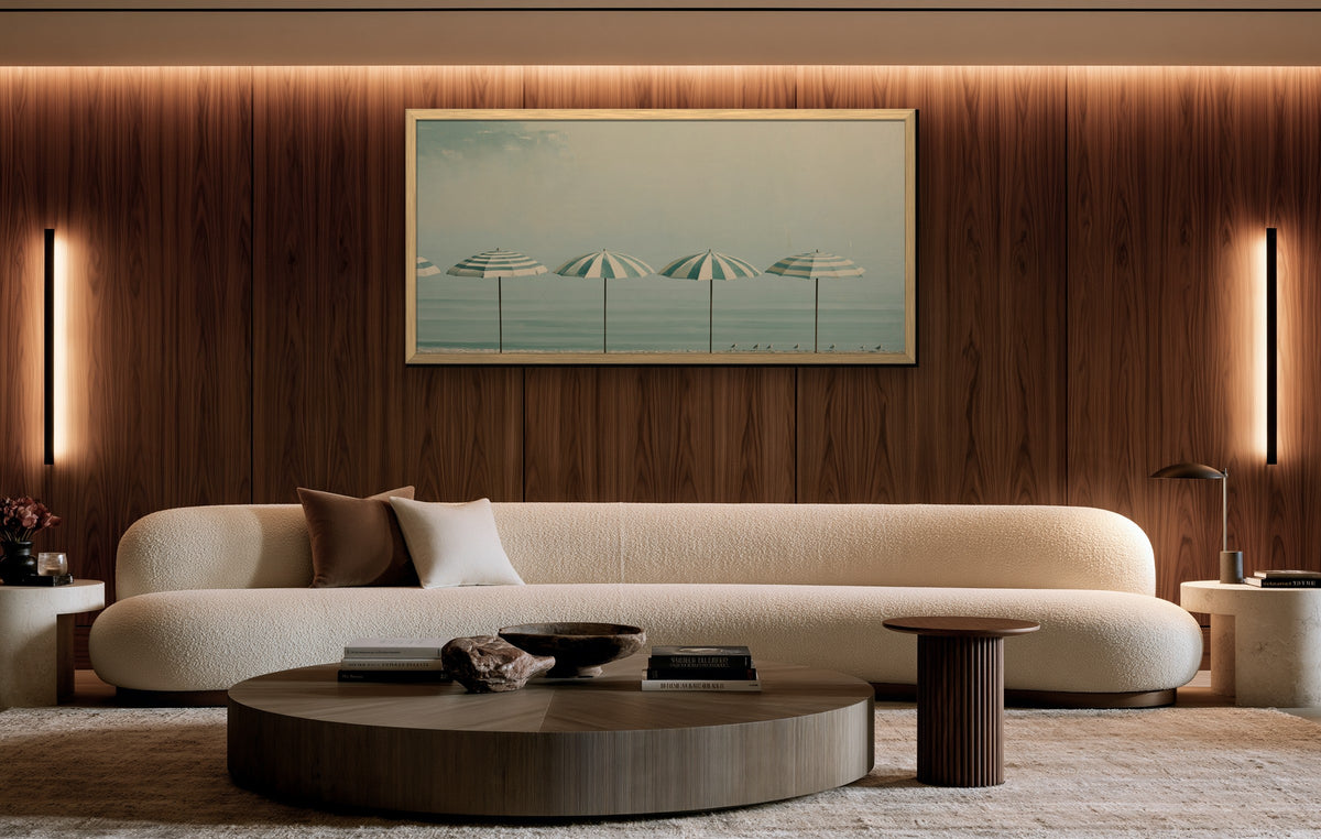 Matin sur la Plage framed canvas in a walnut-paneled living room