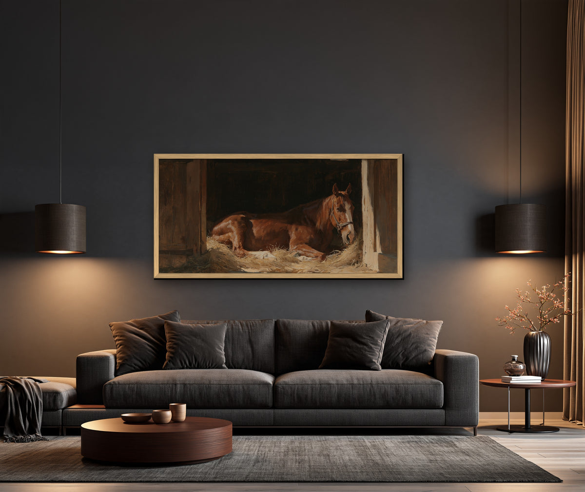 L'Écurie framed canvas in a dark living room